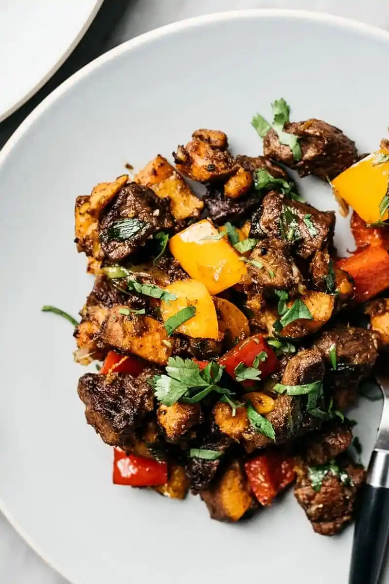 Searing Steak Bites with Sweet Potatoes and Bell Peppers 3 Recipe image